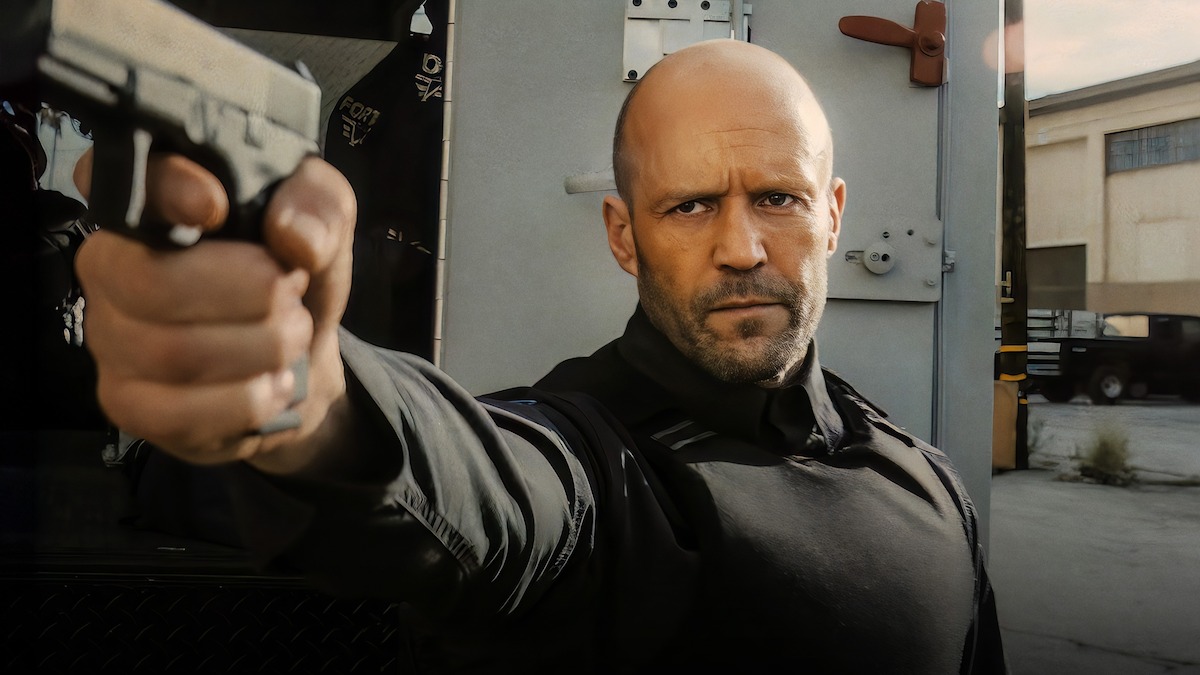 Jason Statham, as H, points a gun in ‘Wrath of Man.’