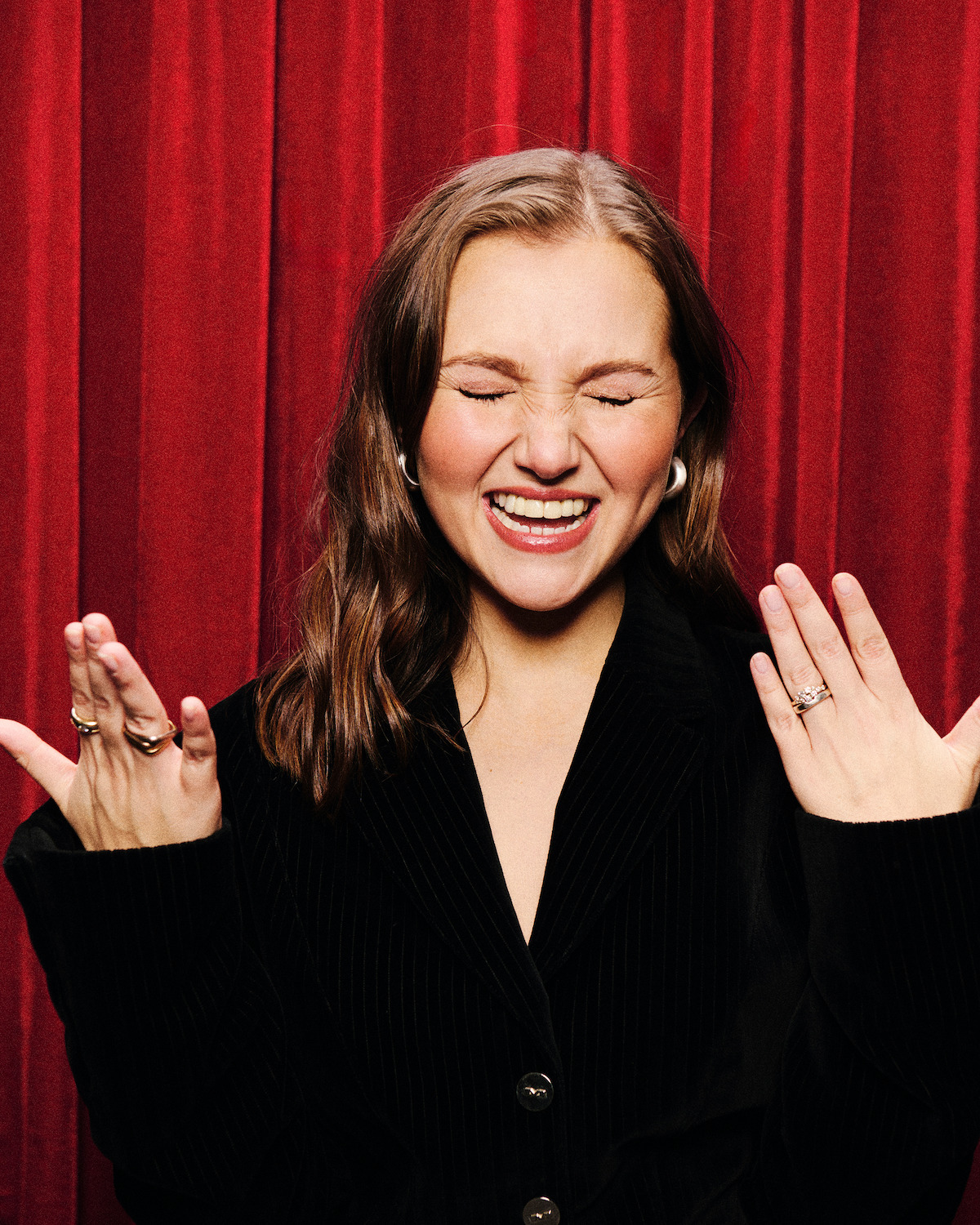 Mia McKenna-Bruce in a photobooth