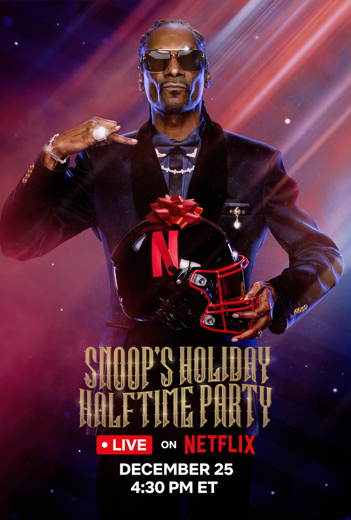 Snoop Dogg in a festive suit holding a football helmet with a red bow, posing confidently under dramatic lighting for a Netflix holiday halftime party special. Event details are included. Mood is celebratory and energetic.
