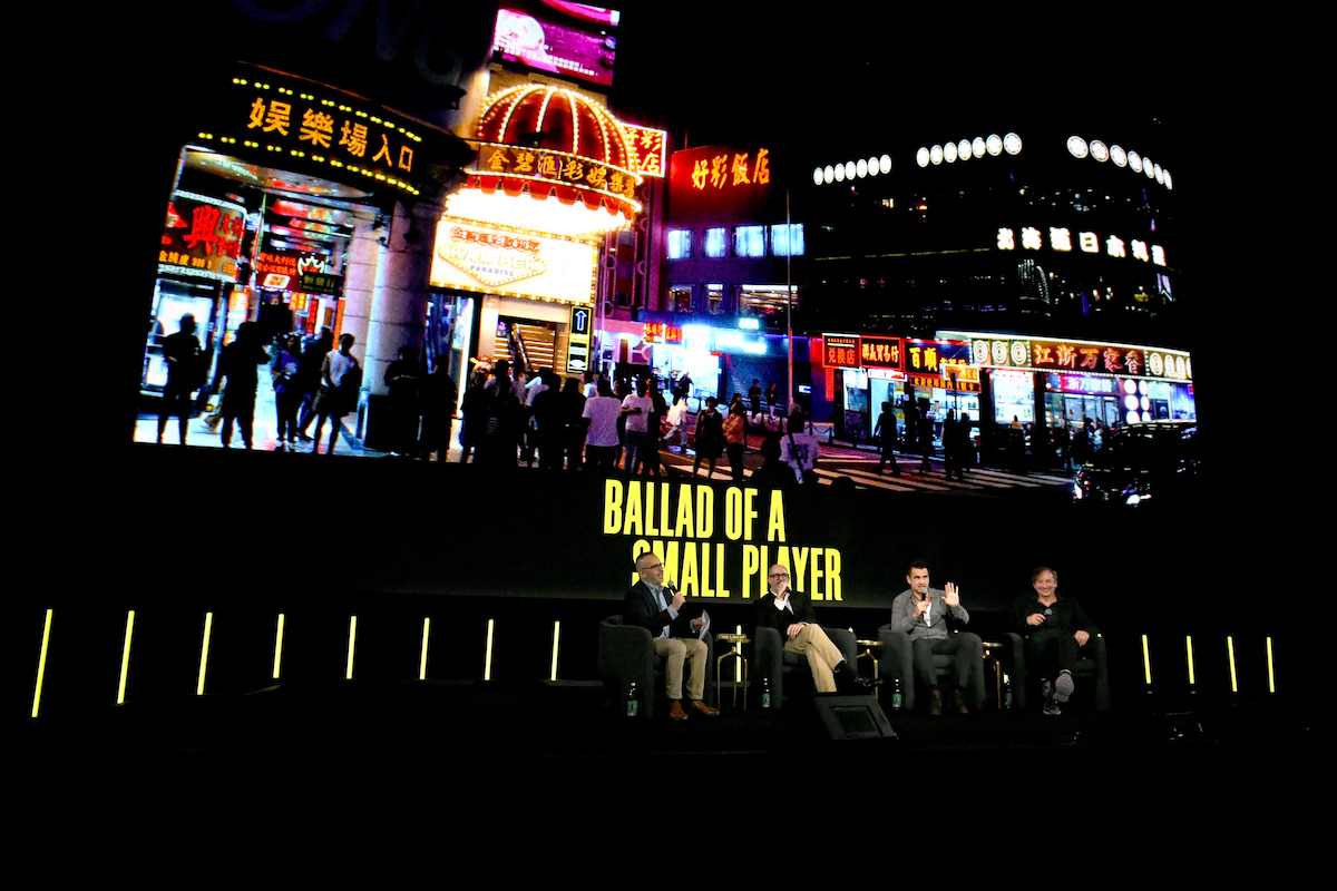 Henry Goldblatt, Edward Berger, Colin Farrell and Volker Bertelmann sitting at a panel about Ballad of a Small Player