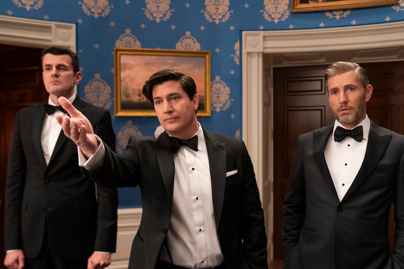 Nathan Lovejoy as Ambassador Alden Tamridge, Ken Marino as Harry Hollinger, Brett Tucker as David Rylance in episode 102 of 'The Residence'.