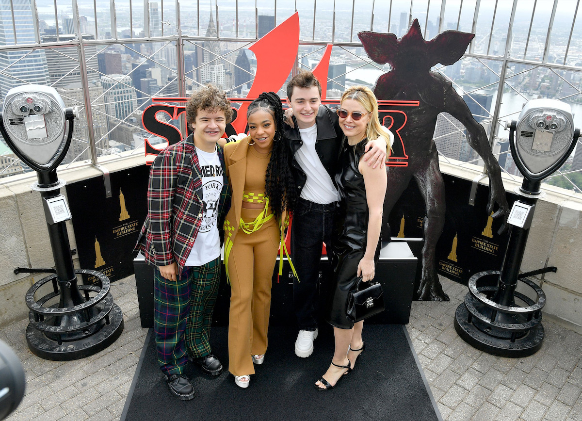 Cara Buono, Noah Schnapp, Priah Ferguson, and Gaten Matarazzo outside - Landmarks Around the World Are Headed to the Upside Down