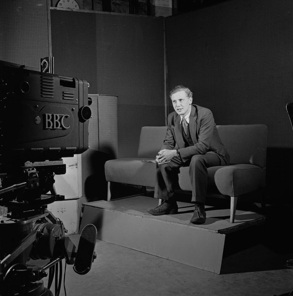 English broadcaster and naturalist David Attenborough at work in a BBC TV studio.