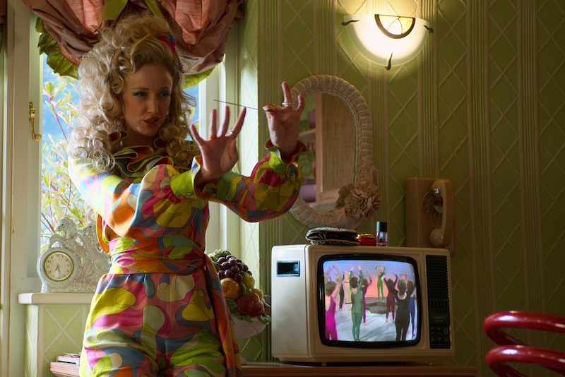 Mrs. Wormwood polishes her nails.