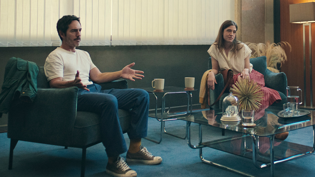 Mauricio Ochmann as Alan Bender and Tato Alexander as Victoria sit together in ‘Non Negotiable.’