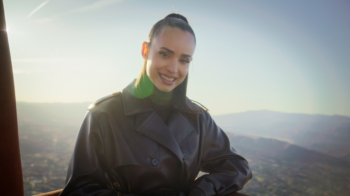 A still of Sofia Carson in a hot air balloon.