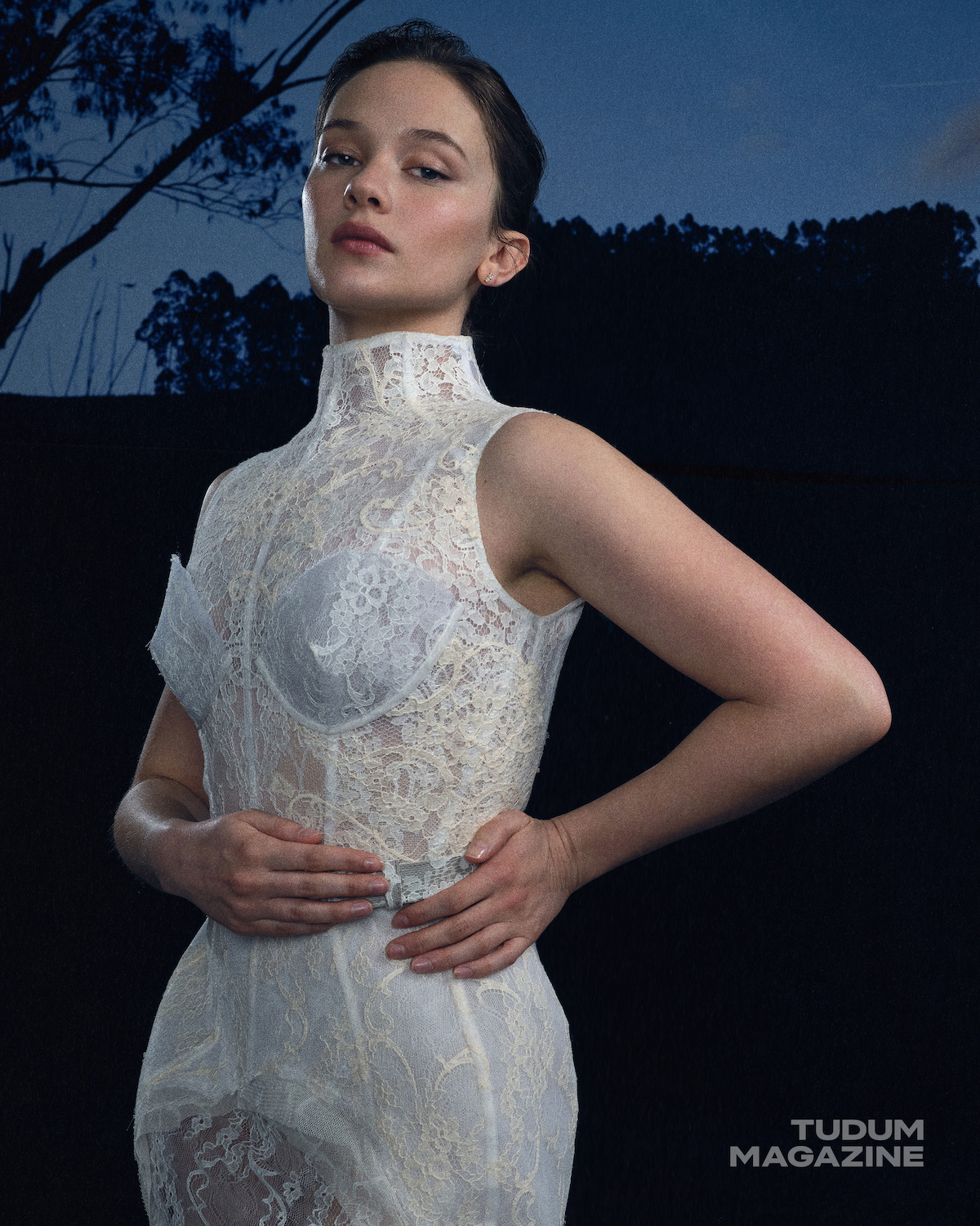 Cailee Spaeny in a white lace dress