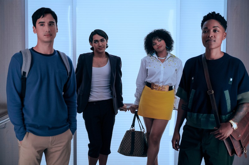 Four people standing in a hallway