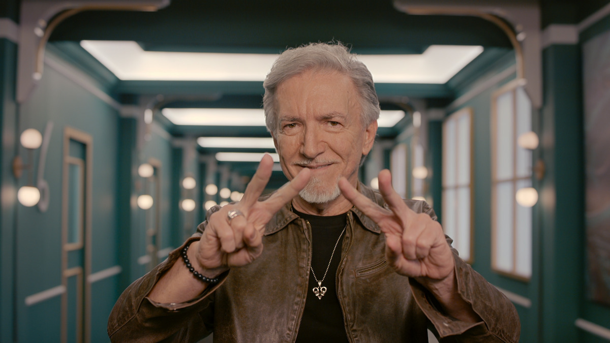 Mario S. flashing peace signs.