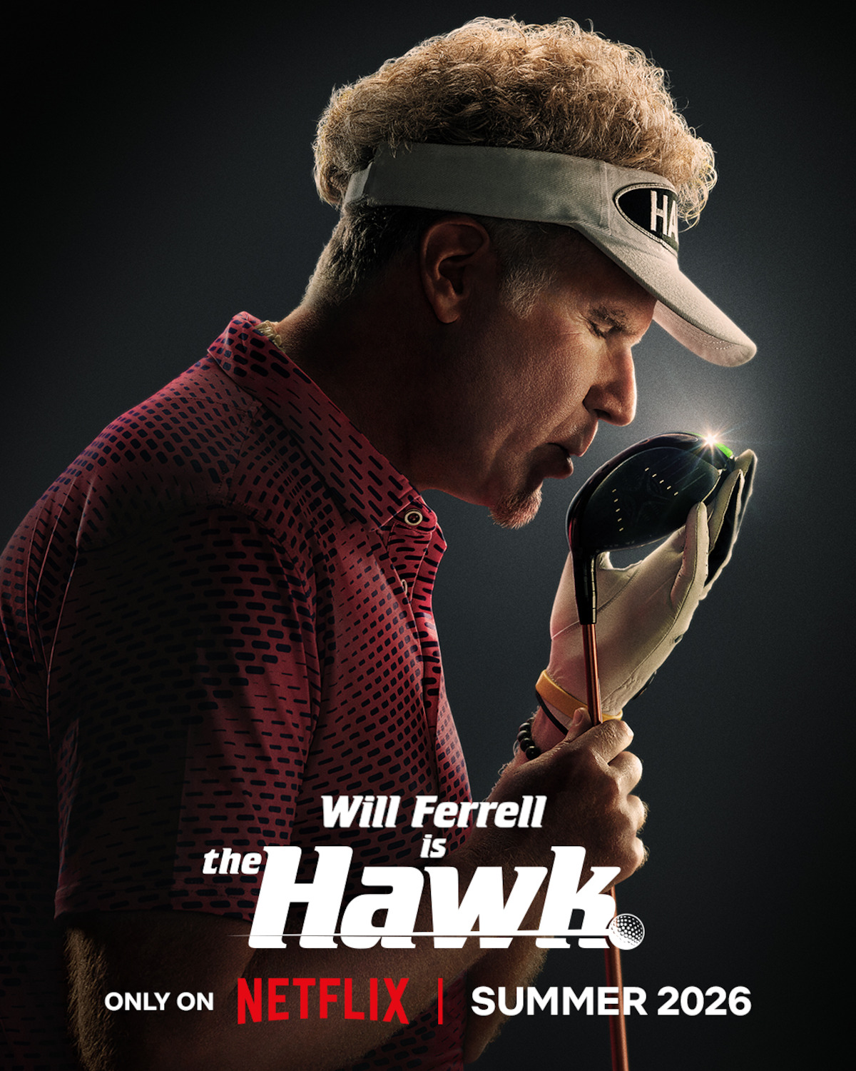 Man in a golf visor and glove holds and admires a golf club in a dramatic, dark studio. Text promotes Will Ferrell as "the Hawk" in a Netflix production, currently available to stream.
