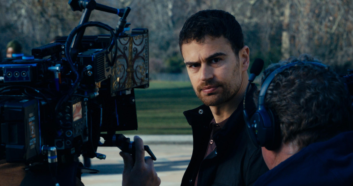 Behind the scenes shot of Theo James as Eddie Horniman working with the crew on the set of season 1 of 'The Gentlemen'