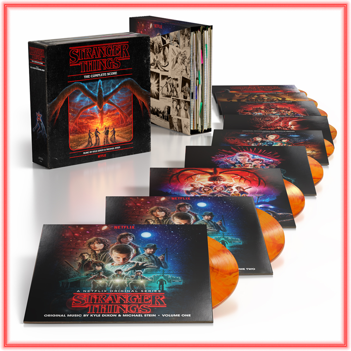 Stranger Things vinyl box set on display, showing multiple orange records and illustrated covers, all themed around the TV series. The box has striking artwork with characters and atmospheric graphics in a collector’s edition format.