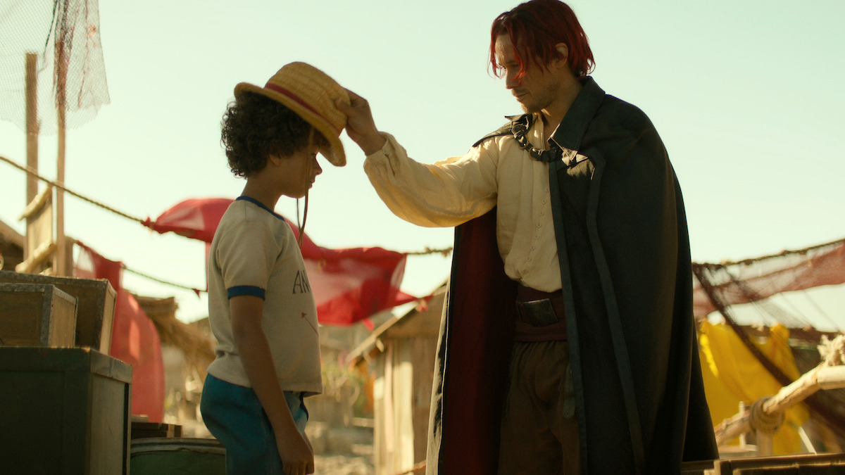 Colton Osorio as Young Luffy and Peter Gadiot as Shanks in ‘ONE PIECE’