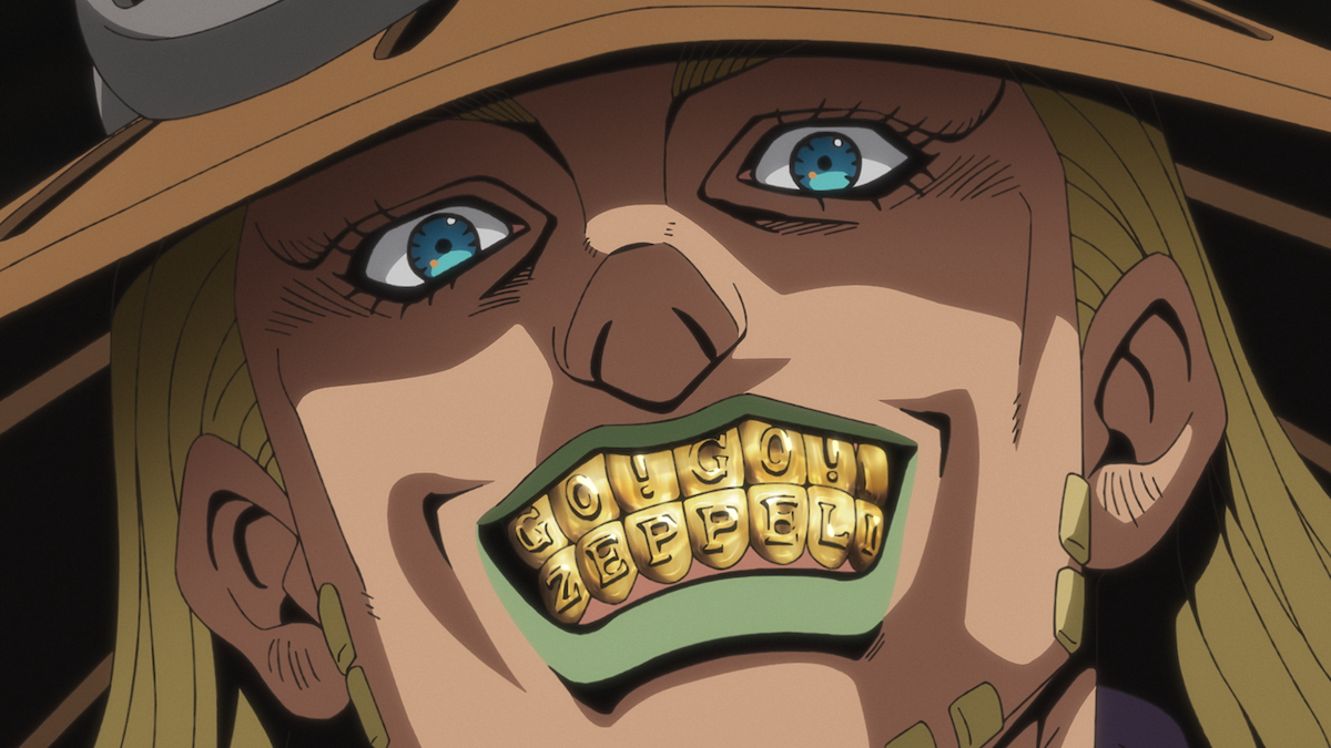Close-up of an animated character with a wide grin, wearing a hat and golden teeth spelling out a name, blue eyes and long blond hair, in a dramatic, brightly lit setting.