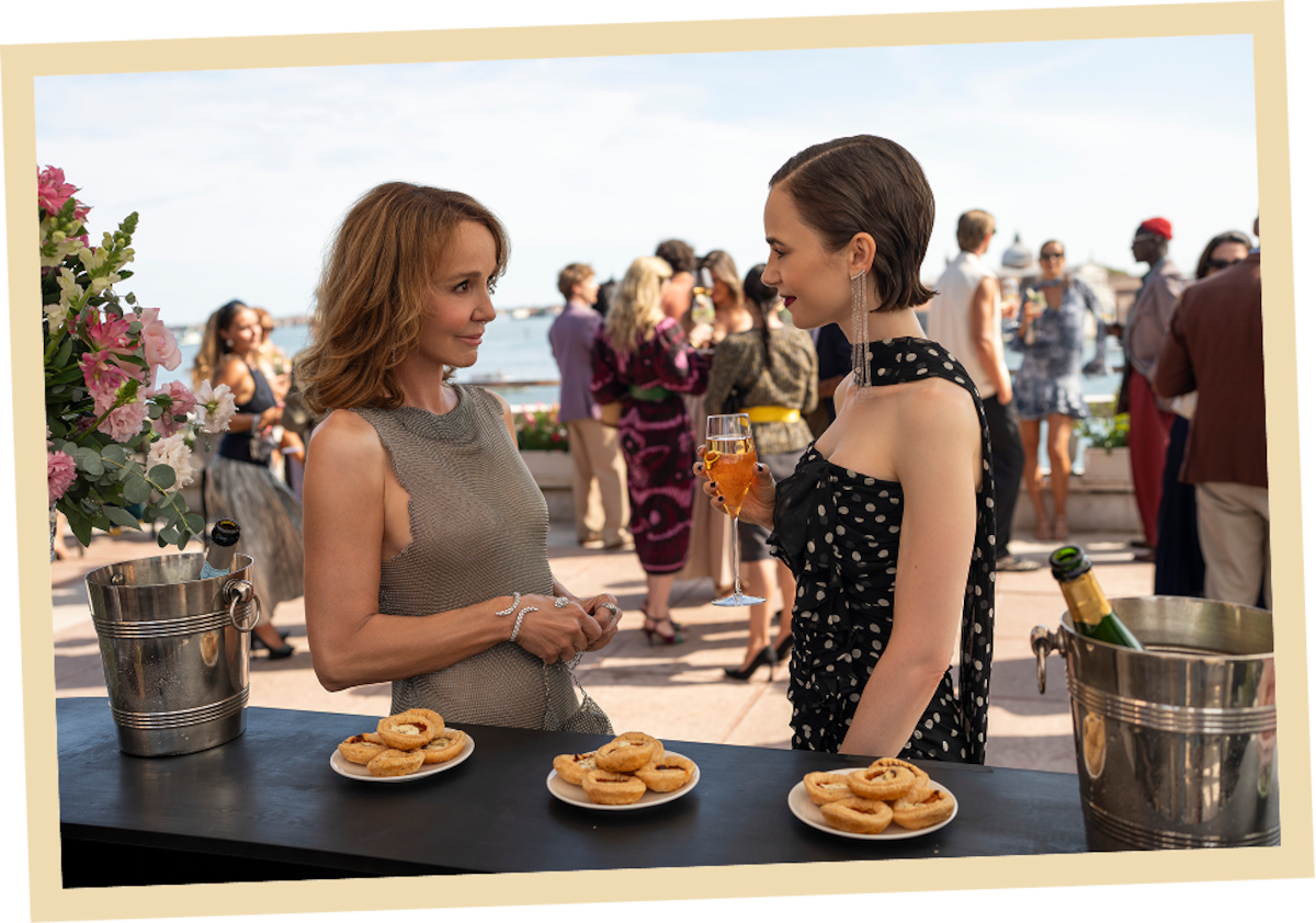 Philippine Leroy-Beaulieu as Sylvie Grateau and Lily Collins as Emily in ‘Emily in Paris’ Season 5.