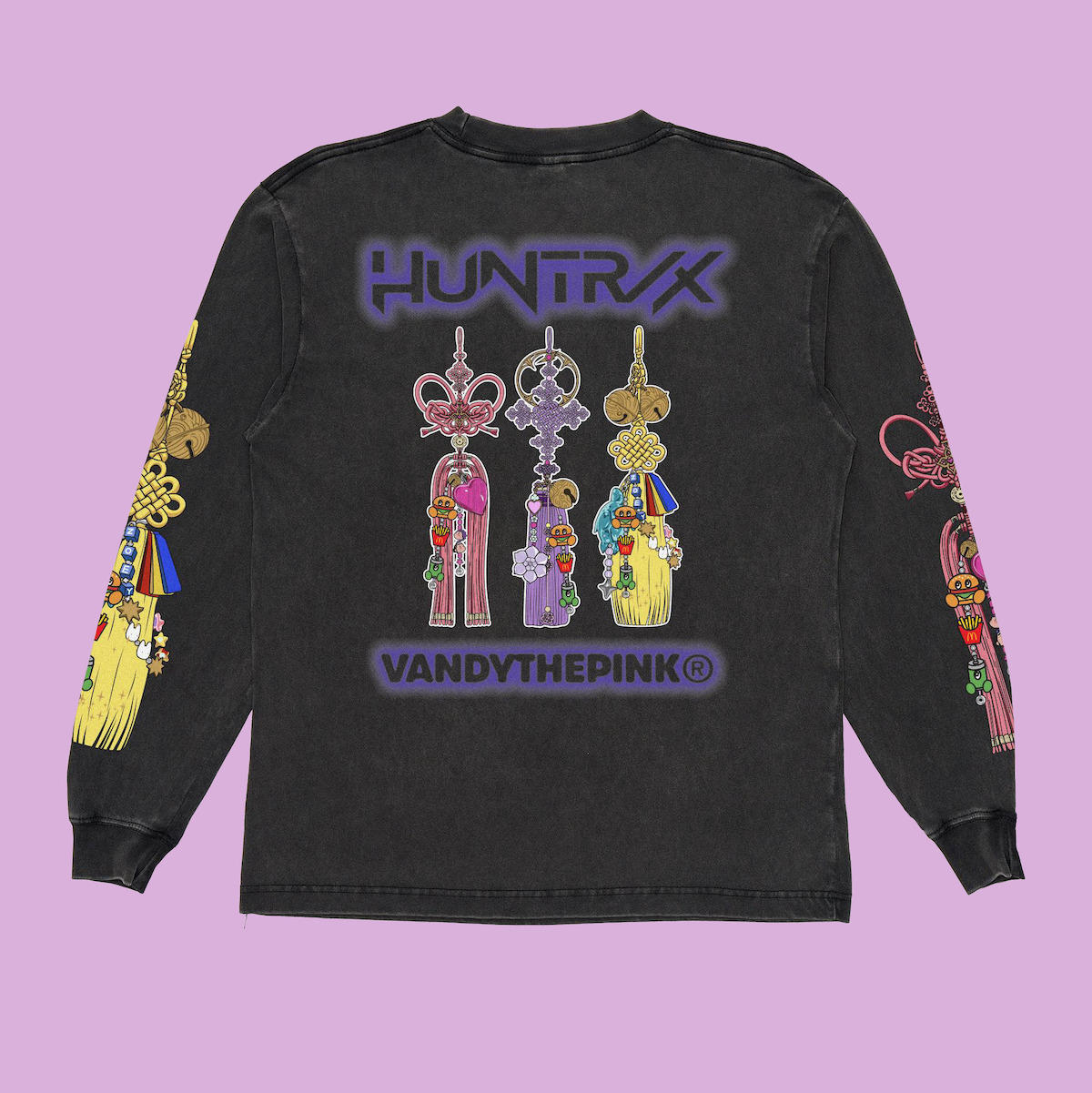 Black long sleeve shirt on a pastel purple background, featuring colorful Korean knot tassel designs and the words "HUNTRX" and "VANDYTHEPINK" on the back and sleeves.