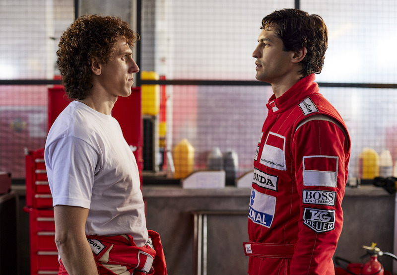 Matt Mella as Alain Prost and Gabriel Leone as Ayrton Senna stand facing each other in ‘Senna’