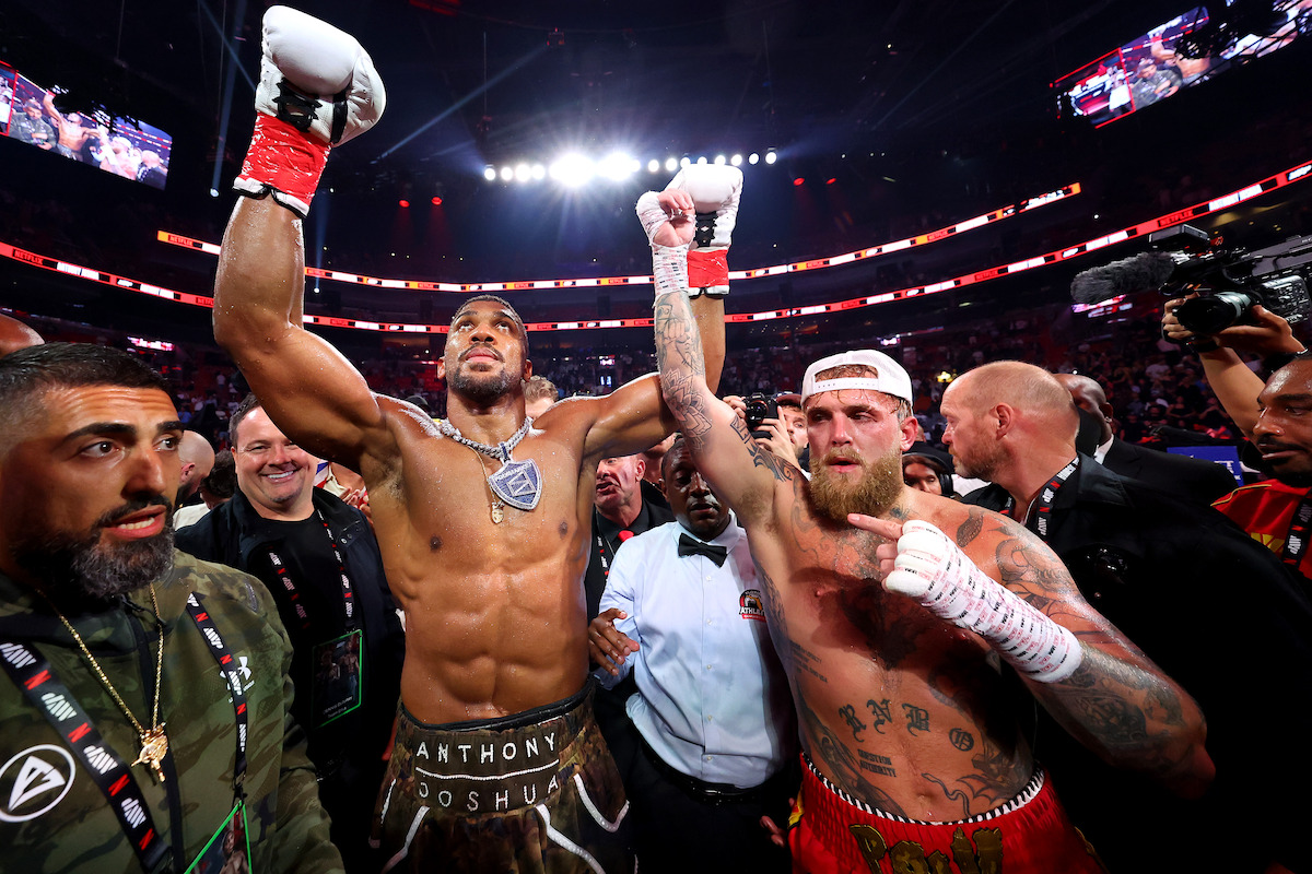 Anthony Joshua celebrates victory over Jake Paul after their heavyweight bout.