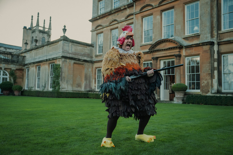 Daniel Ings wears a chicken costume in Season 1 of ‘The Gentlemen.’