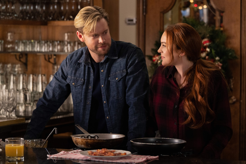 Chord Overstreet and Lindsay Lohan share a moment over breakfast in Falling For Christmas. 