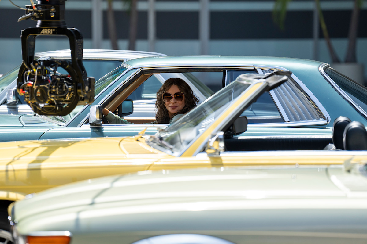 Behind-the-scenes photo of Sofia Vergara in a car as Griselda.