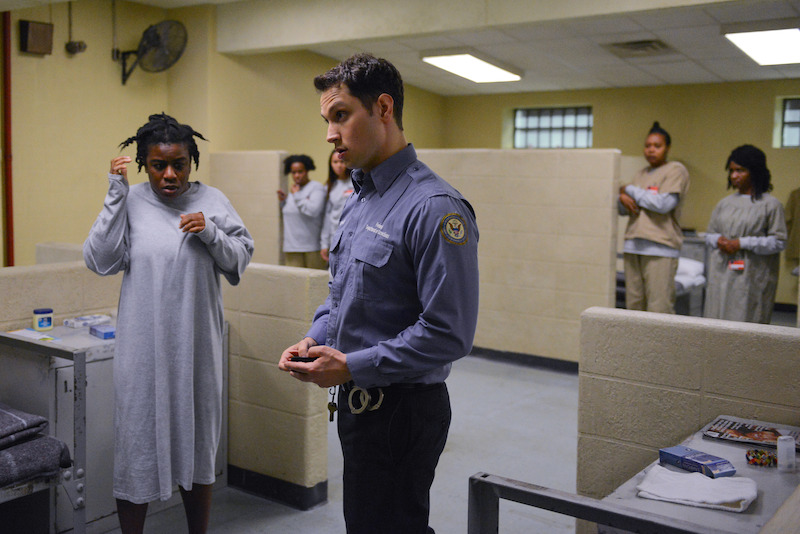 (L to R) Uzo Aduba as Suzanne "Crazy Eyes", Matt McGorry as John in Orange Is The New Black Season 2.