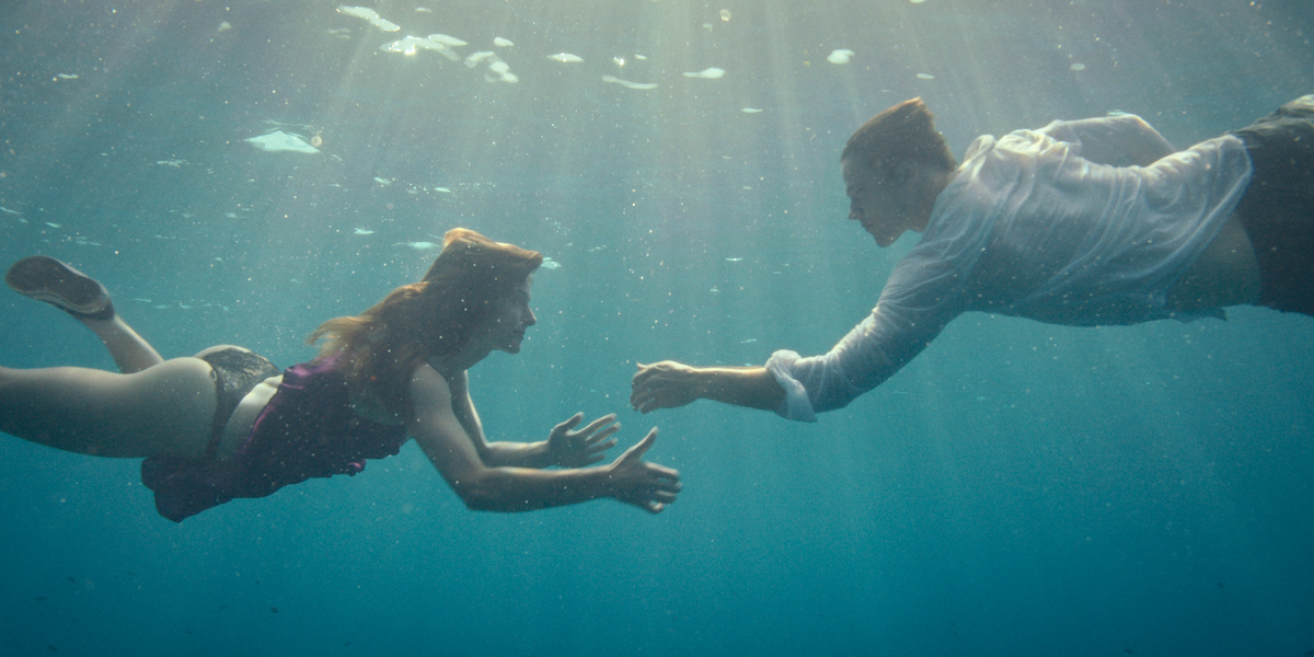 Svenja Jung as Lilli and Theo Trebs as Tom go for a swim in a production still from ‘Fall For Me.’