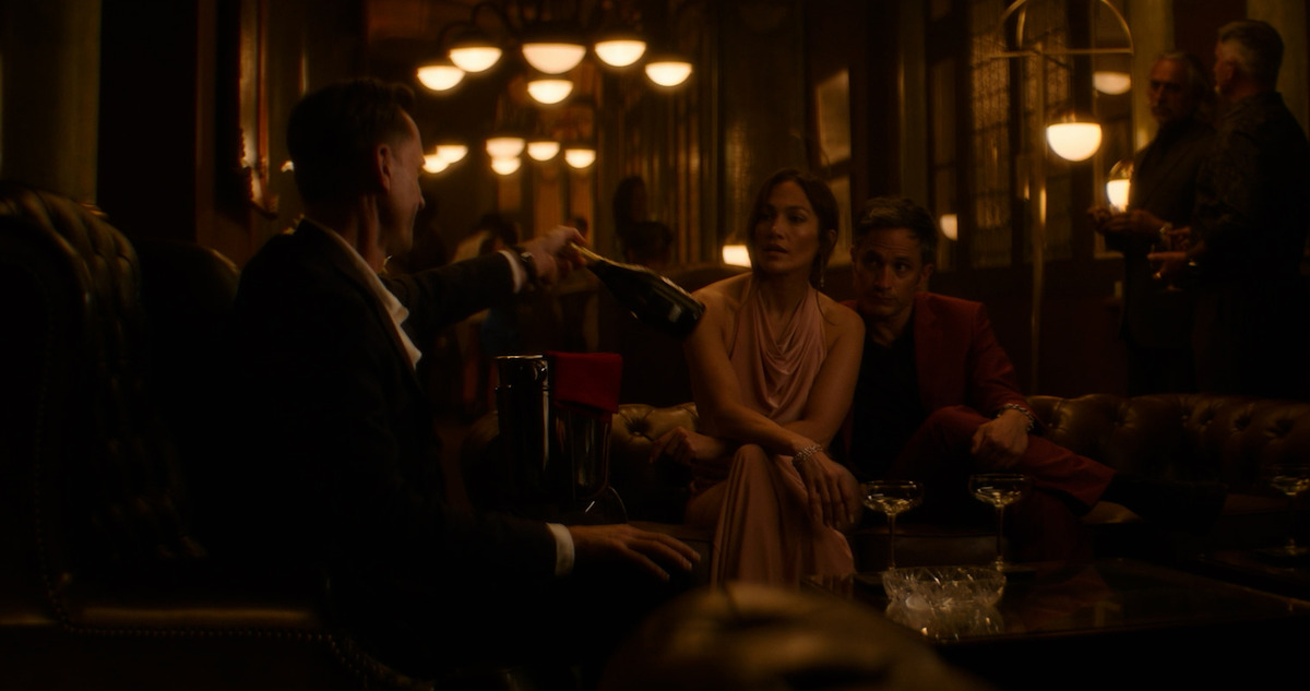 Joseph Fiennes, Jennifer Lopez and Gael Garcia Bernal share a drink in an extended flashback from 'The Mother.'