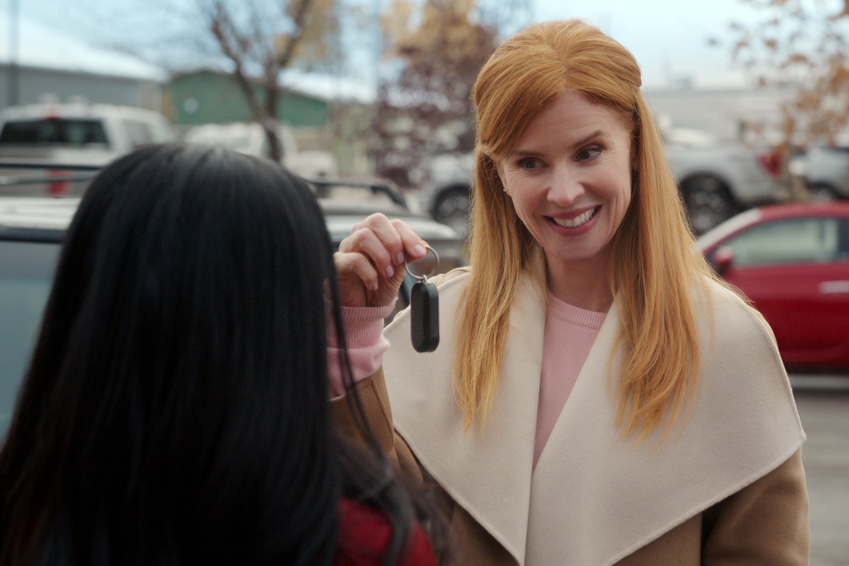 Sarah Rafferty as Katherine holding up car keys in ‘My Life with the Walter Boys’ Season 2.