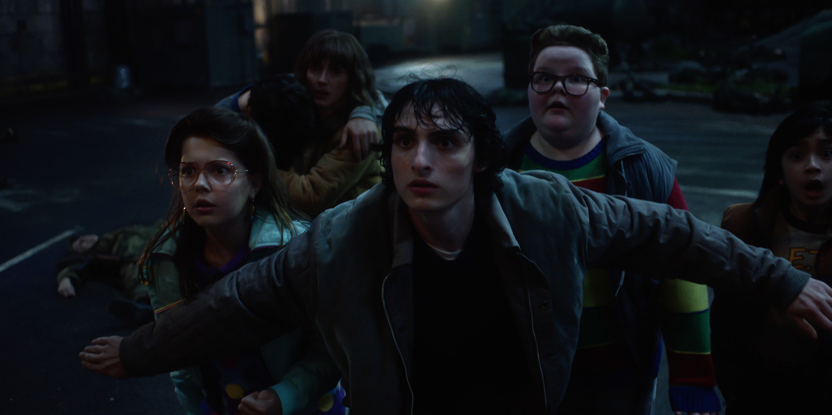 Winona Ryder as Joyce Byers, Finn Wolfhard as Mike Wheeler and Jake Connelly as Derek in ‘Stranger Things 5'