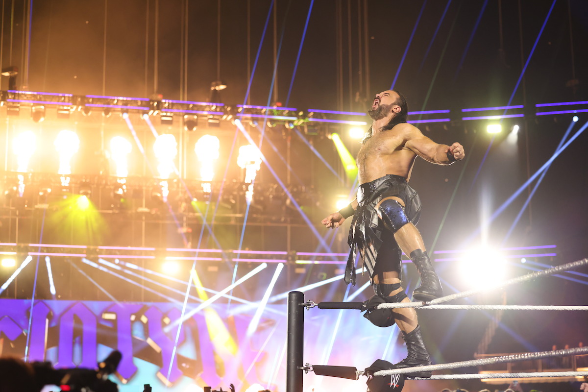 Drew McIntyre stands on the ropes yelling towards the crowd.