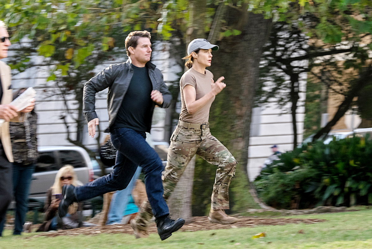 Tom Cruise as Jack Reacher and Cobie Smulders as Major Susan Turner run together in an image from the film ‘Jack Reacher: Never Go Back.’