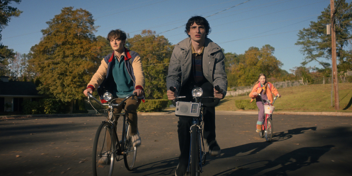 Noah Schnapp as Will Byers, Finn Wolfhard as Mike Wheeler, and Nell Fisher as Holly Wheeler in ‘Stranger Things 5’