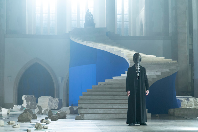A masked Morpheus (Tom Sturridge) stands in the ruins of his throne room in the Dreaming.