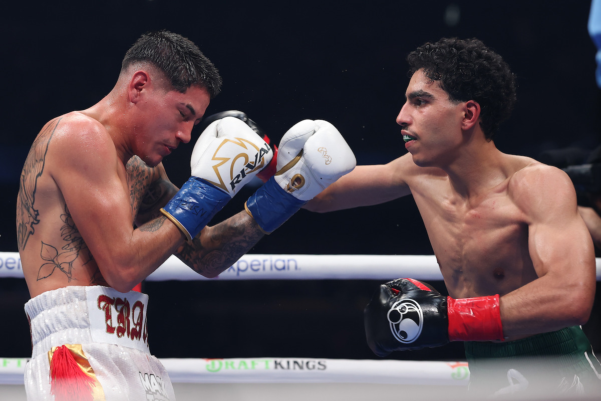 Mohammed Alakel punches Travis Crawford in their lightweight bout.