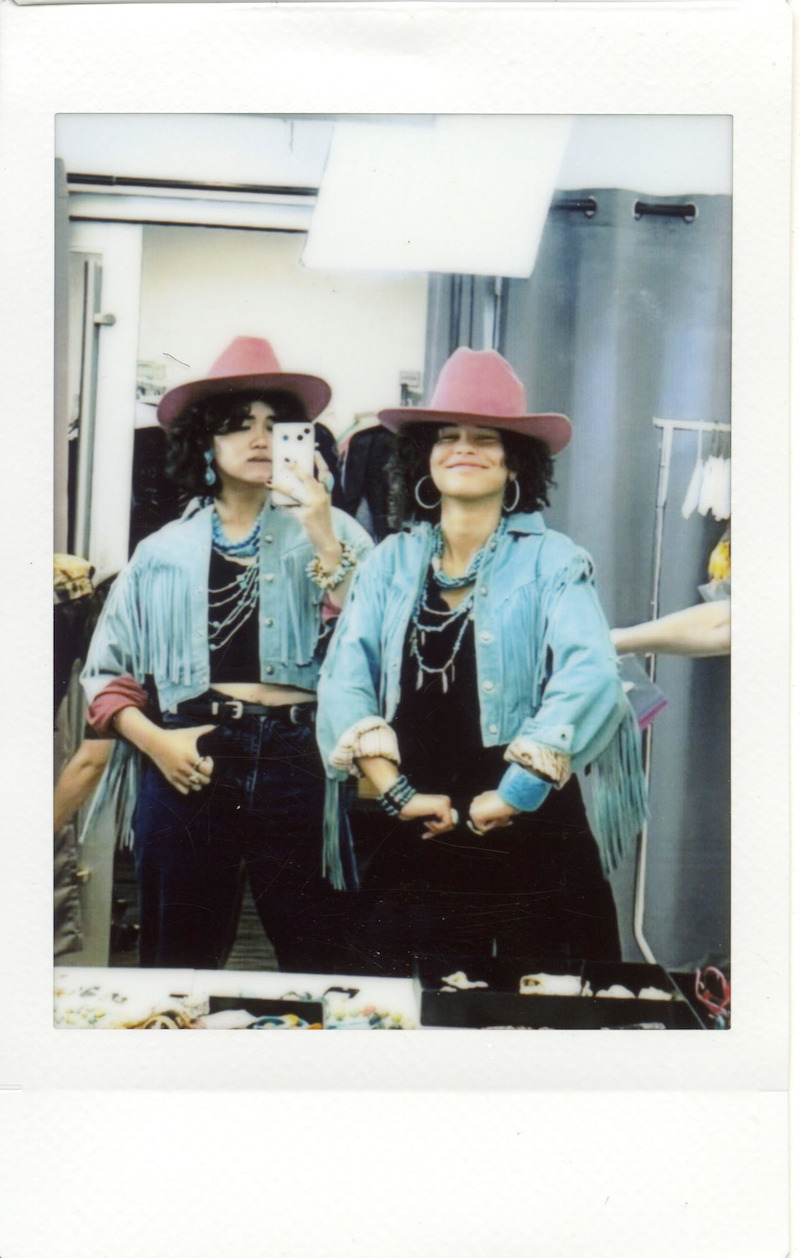 Morelos and Aufderheide twinning in pink cowboy hats and denim jackets backstage.