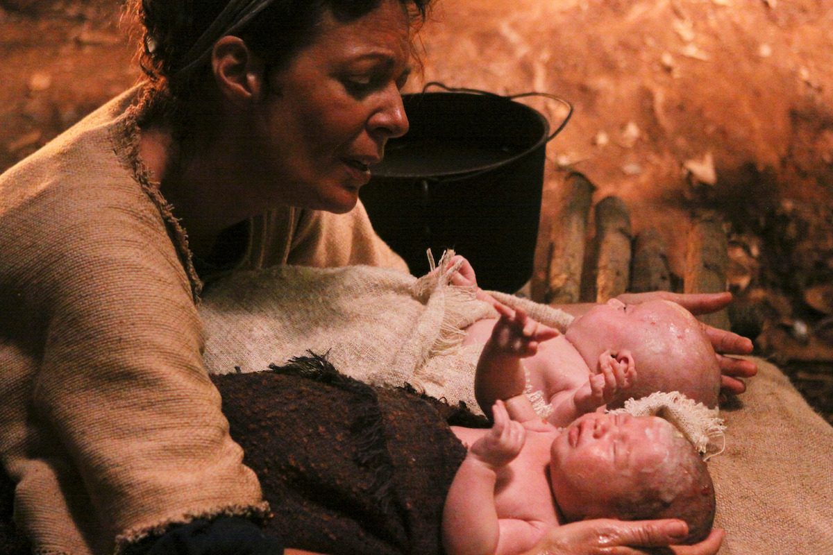 Allison Janney holds two newborn babies.