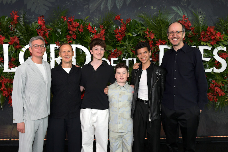 A group of people pose.