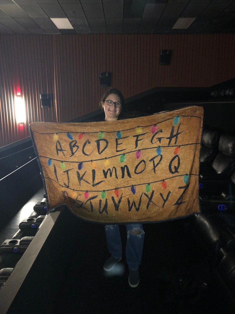 One fan had their Joyce Byers–approved blanket ready for the Stranger Things Day screening in Miami.