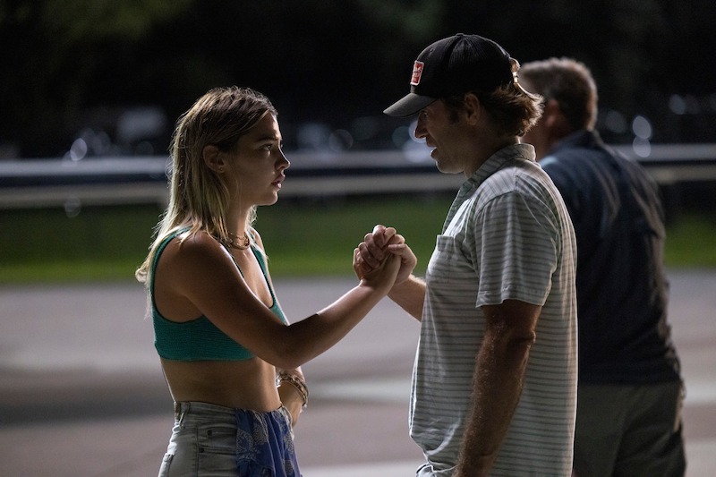 Madelyn Cline as Sarah Cameron and Director Jonas Pate in Outer Banks Season 3 Behind-the-Scenes Photo Gallery