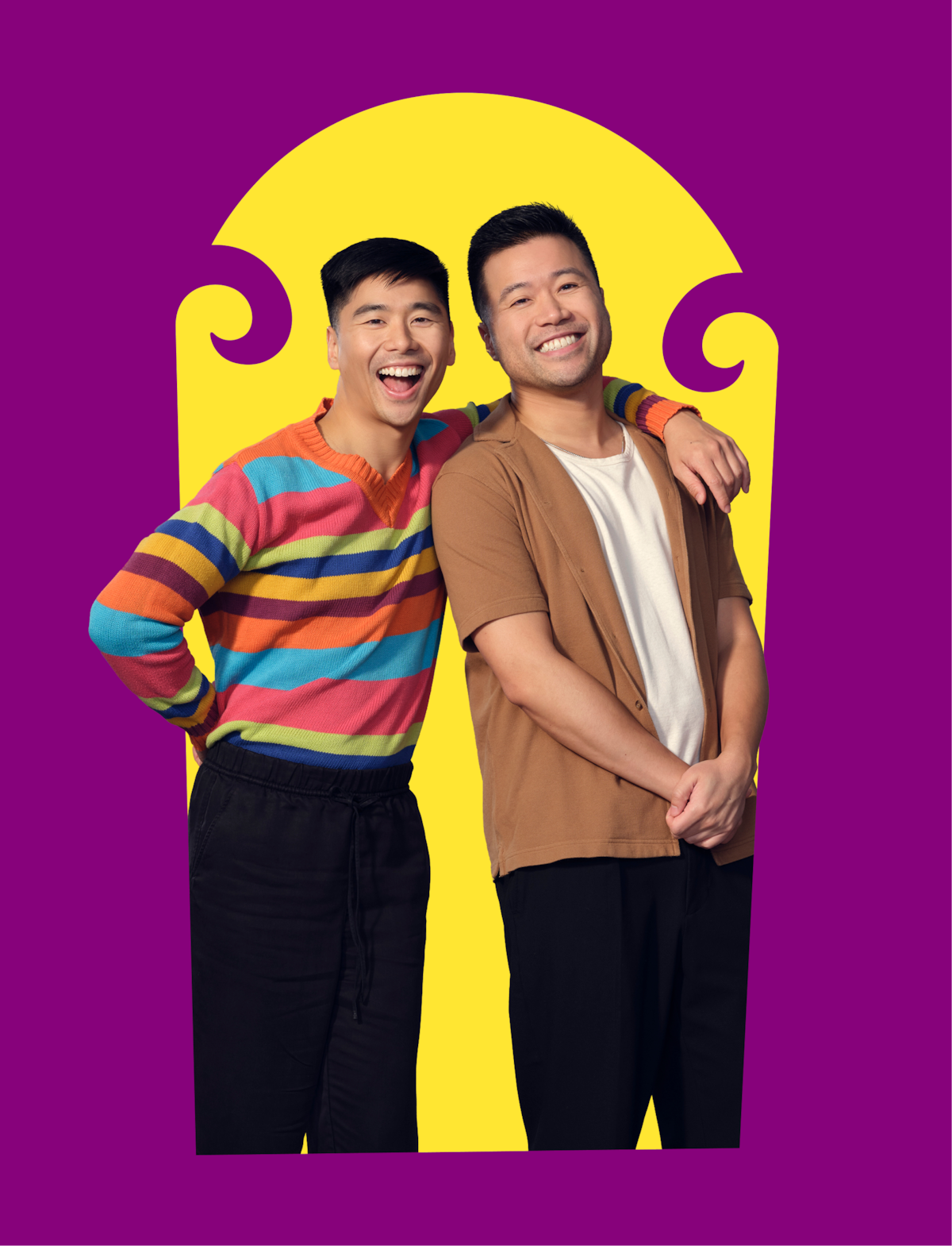 Two smiling people stand close together; one in a colorful striped sweater, the other in a brown shirt, in front of a bright yellow arch on a purple background, appearing happy and relaxed.
