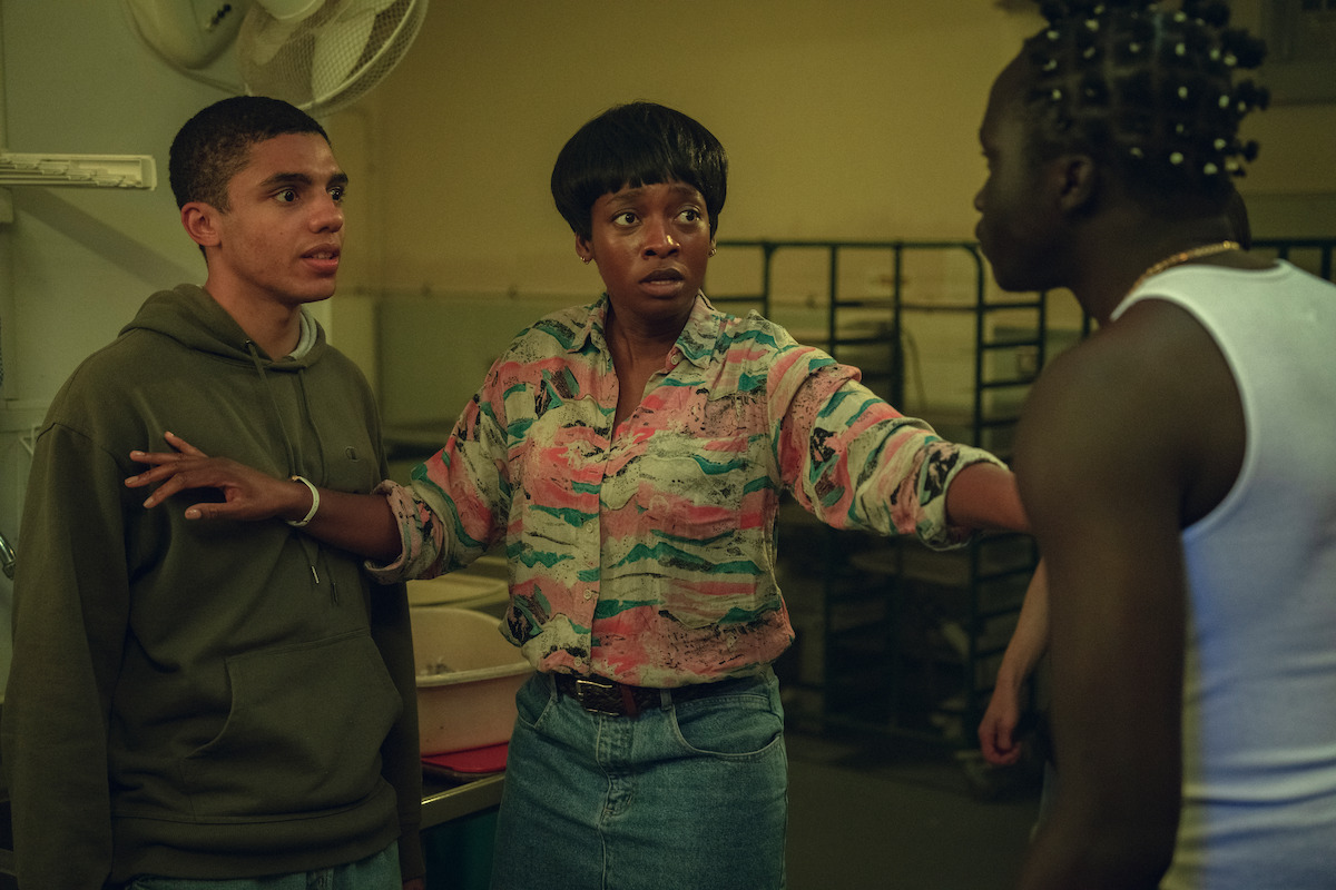 Jay Lycurgo as Shy and Simbiatu Ajikawo as Shola stopping a confrontation.