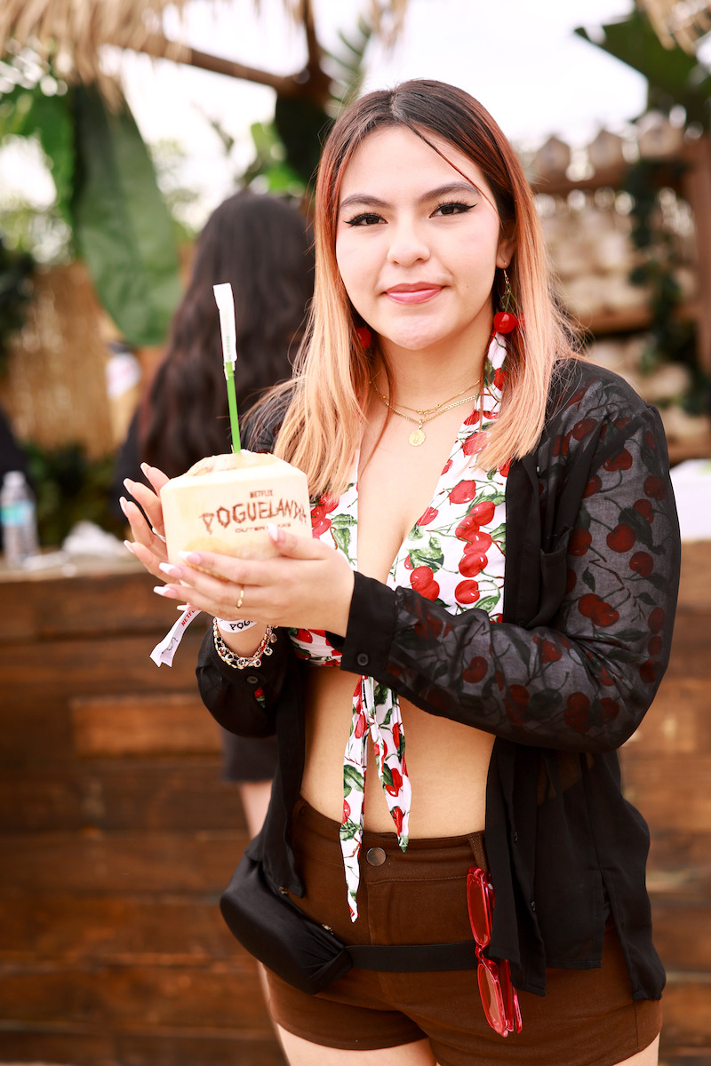 fan holding a coconut