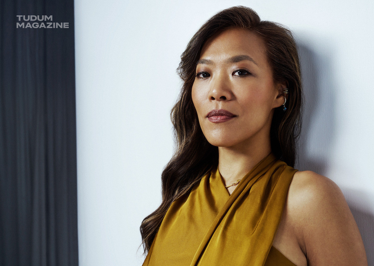 Shih-Ching Tsou stands against a white backdrop.