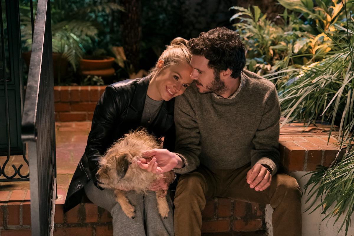 Kristen Bell as Joanne and Adam Brody as Noah sit on a stoop together in Season 1 of ‘Nobody Wants This.’