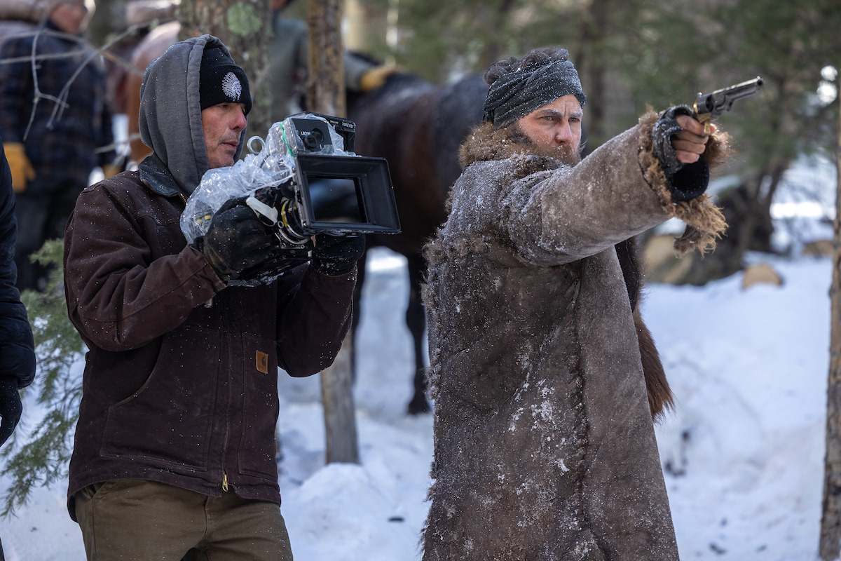 Director/Executive Producer Peter Berg and Taylor Kitsch as Isaac behind the scenes of 'American Primeval'