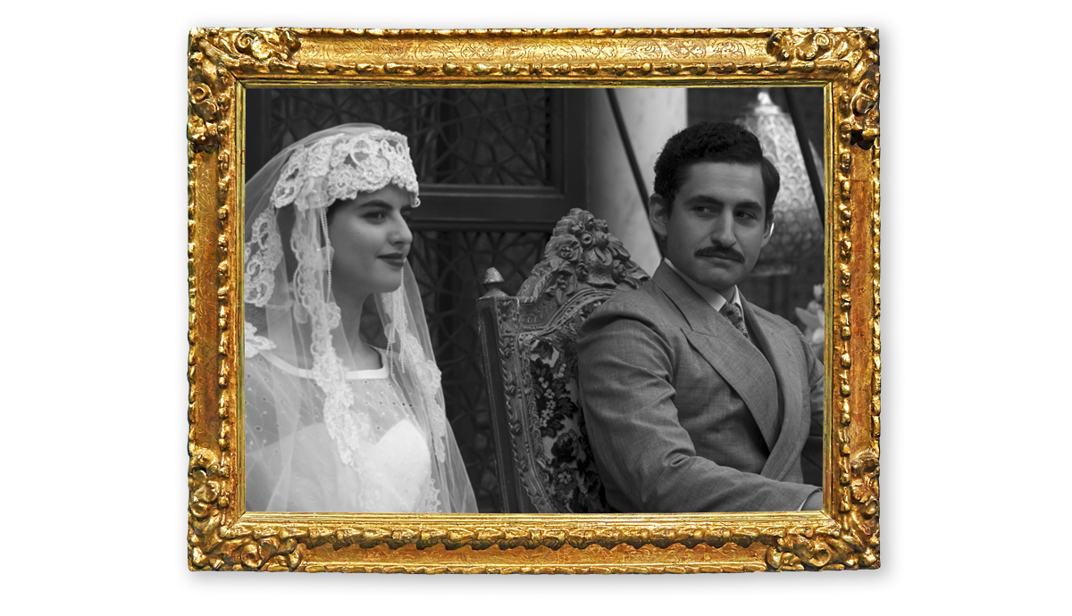 Mohamed Fayed (later al-Fayed, played by Salim Daw) sitting next to a woman wearing a white veil. 