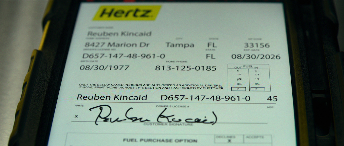A Hertz rental agreement signed by Reuben Kincaid.