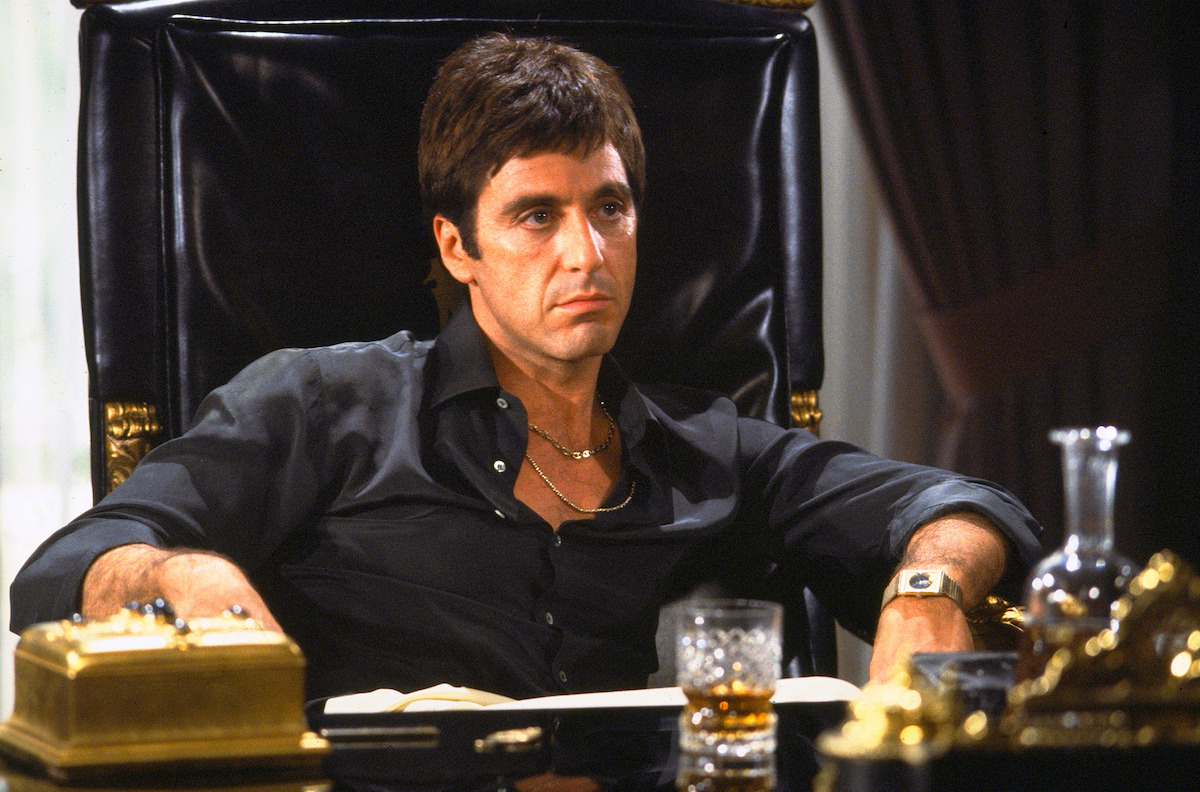 Al Pacino as Tony Montana sits at his desk in ‘Scarface.’