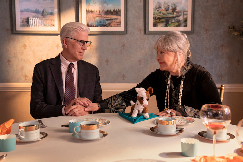 Ted Danson as Charles and Susan Ruttan as Gladys hold hands at a breakfast table in Season 1 of 'A Man on the Inside'